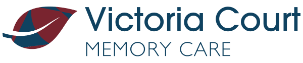 Victoria Court Memory Care logo with text and blue and red leaf icon