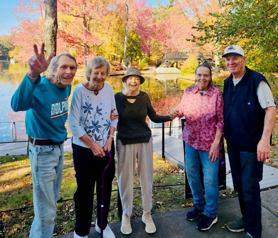 senior friends smiling together during Rhode Island fall season